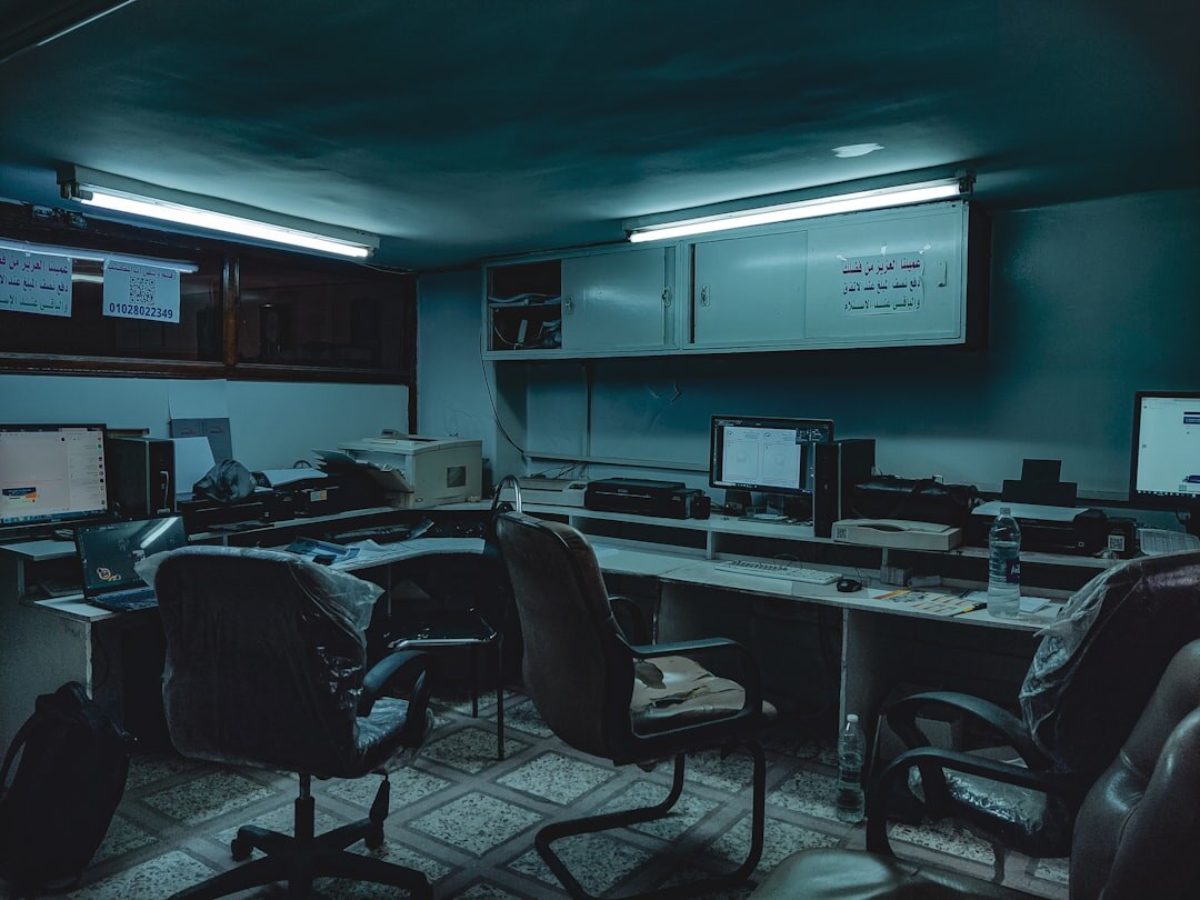 Multi-screen news deck management control room with multiple monitors